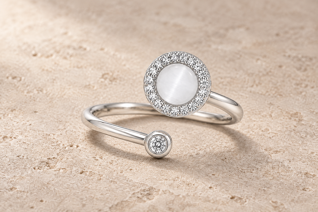 The Lunar Ring with a white moonstone-effect center, crystal halo and silver crossover band.
