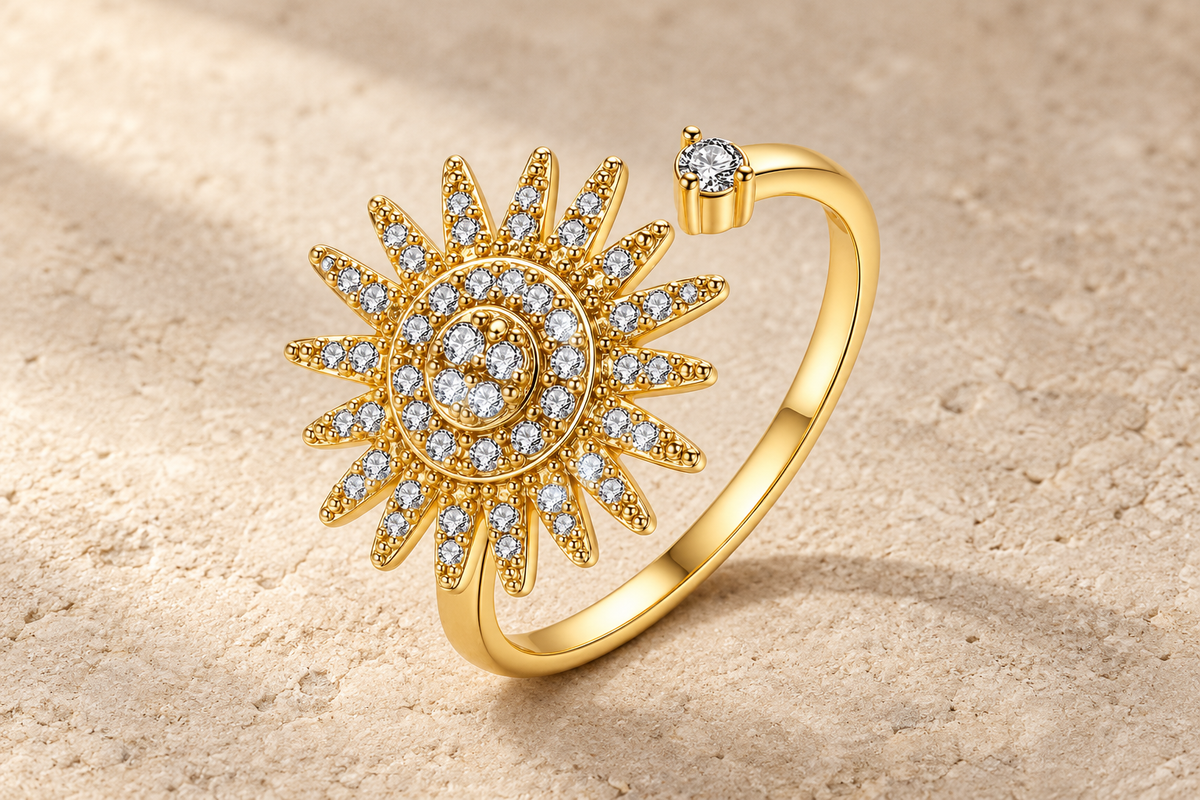 The Radiant Sun Ring with crystal-studded sun rays and an open gold-tone band.