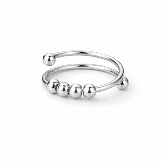 Silver open ring with spherical beads on a white background