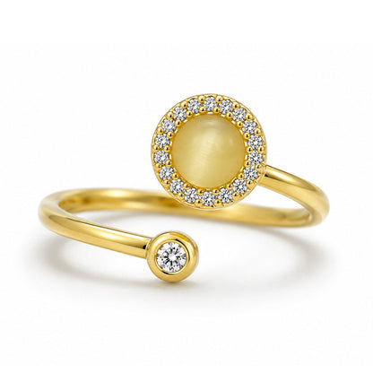 The Lunar Ring in gold with a moonstone-effect centerpiece and crystal halo