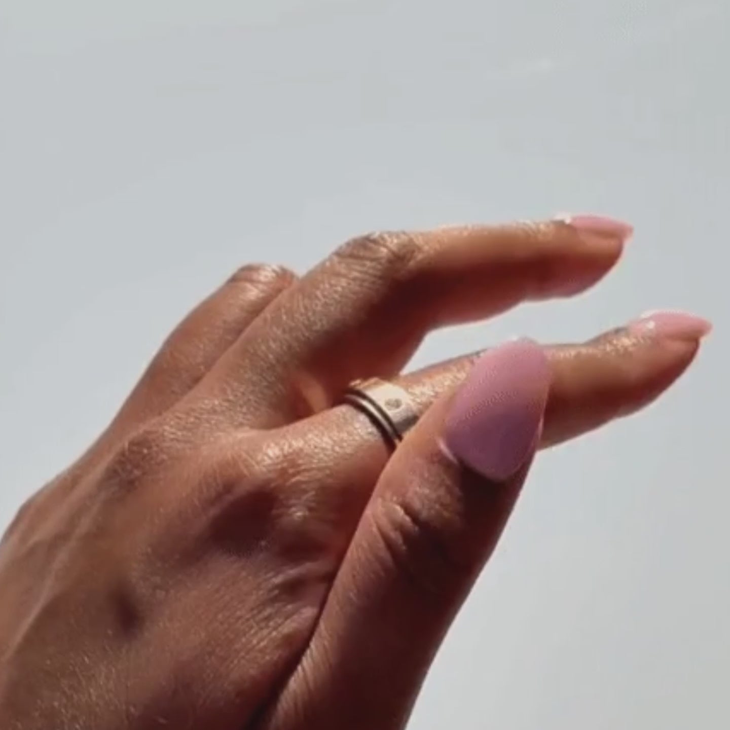 The Orbit Ring crystal spinner band in motion