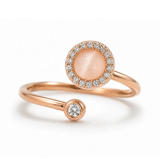 The Lunar Ring in rose gold with a moonstone-effect centerpiece and crystal halo